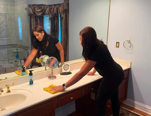 Team cleaning a living room